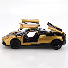 (Bagged) 1/43 scale gold pullback racing car, die-cast metal, three doors that open.