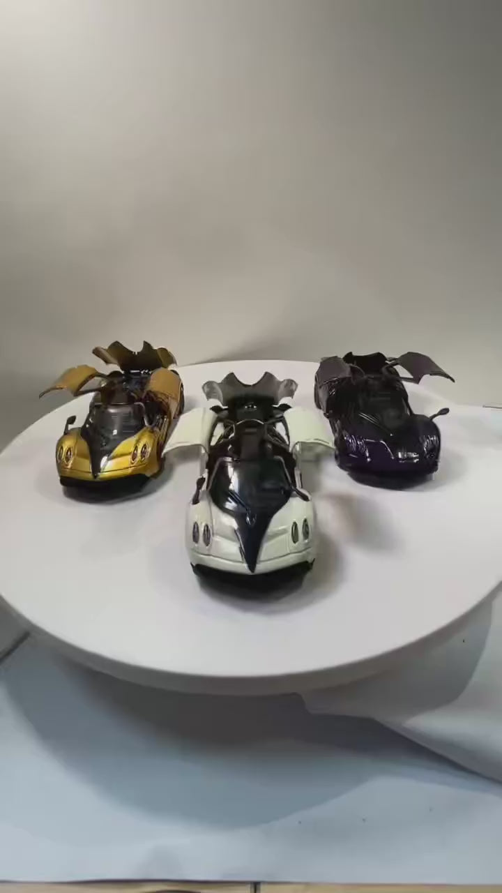 (Bagged) 1/43 scale gold pullback racing car, die-cast metal, three doors that open.